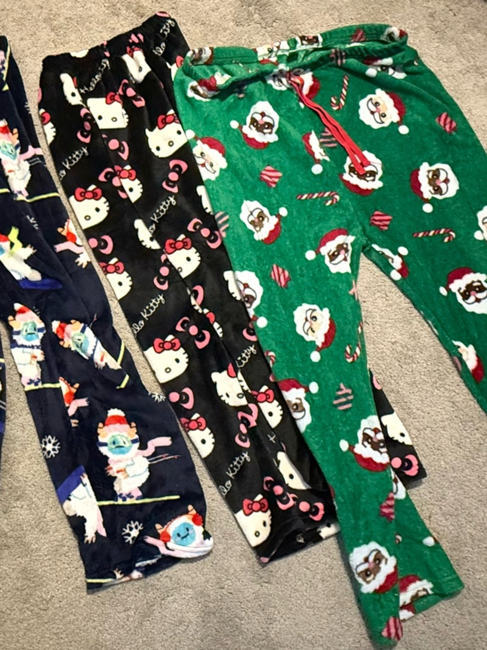 Hello Kitty Black Childs Small.   Yeti and Santa bottoms size large women’s